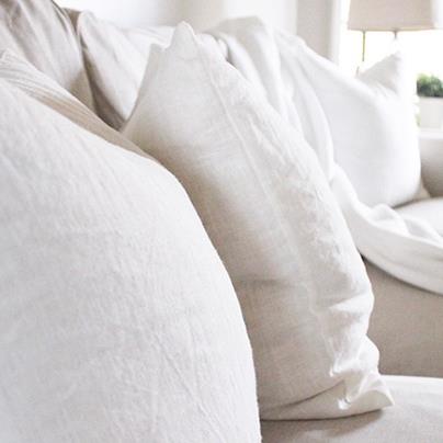 closeup of white cushion on white couch