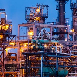exterior shot of an oil refinery at dawn