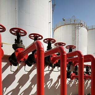 oil pipeline with red valves in oil refinery