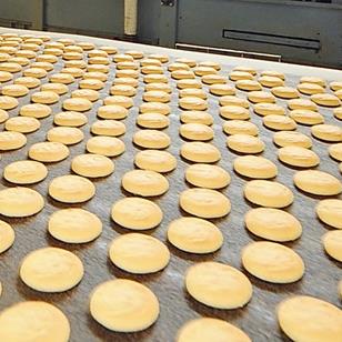 production line of cookies on industrial food conveyor belt