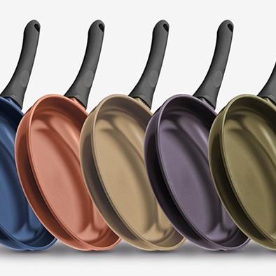 series of 5 different color teflon pans