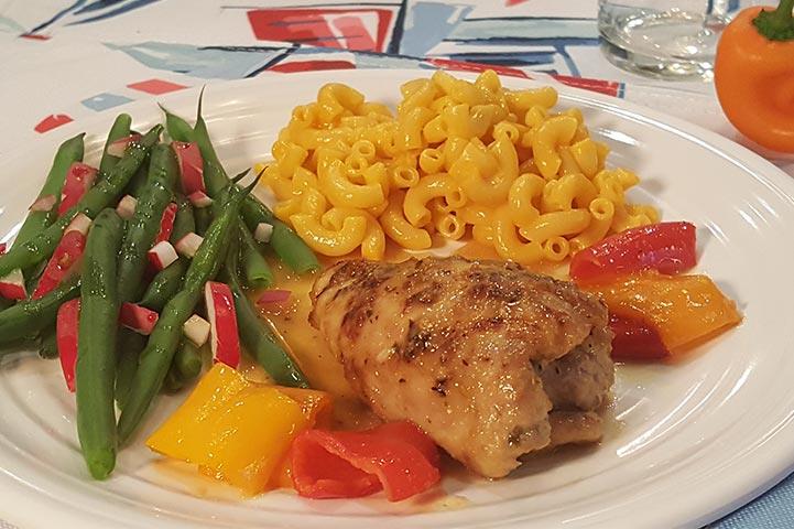 Skillet chicken, mac and cheese, and green beans on a plate