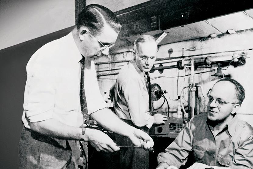 black and white photo of dr roy plunkett and two other dupont chemists