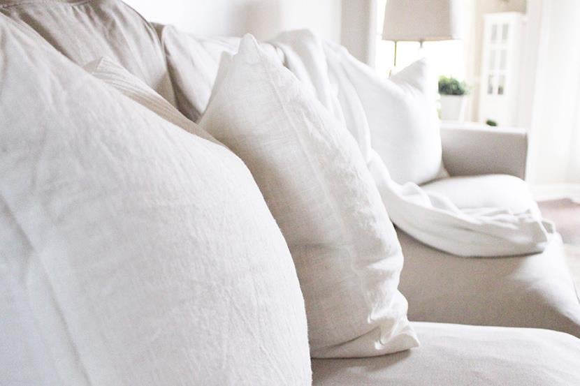 closeup of white cushion on white couch