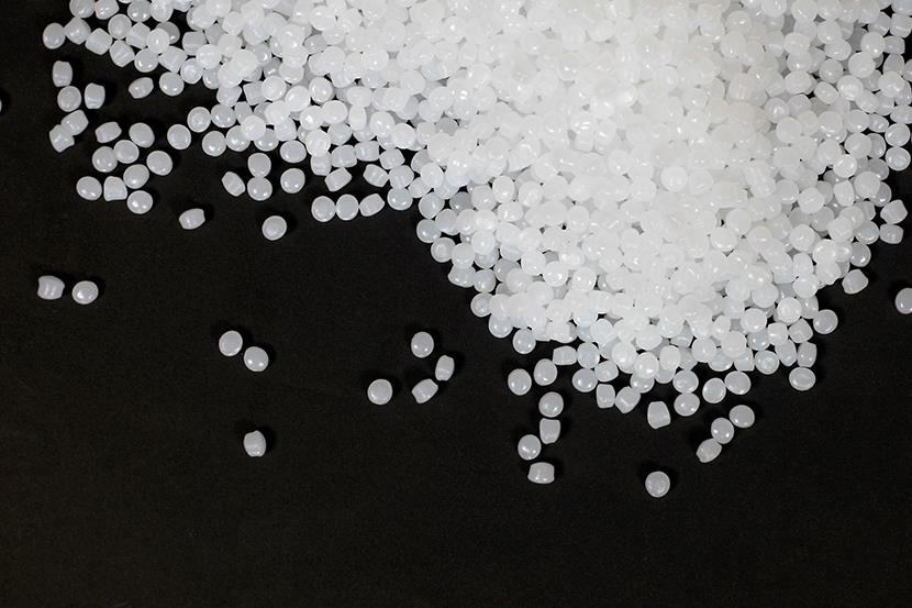 polymer pellets isolated on black background